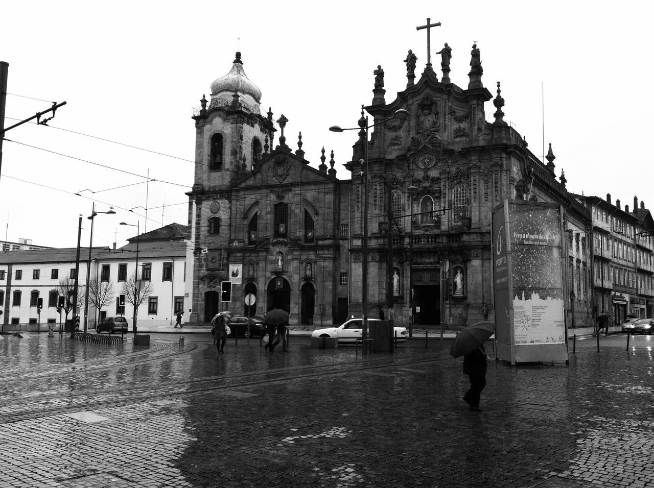 building exterior, architecture, built structure, clear sky, street, incidental people, city, place of worship, facade, travel destinations, church, cobblestone, religion, travel, history, dome, sky, transportation