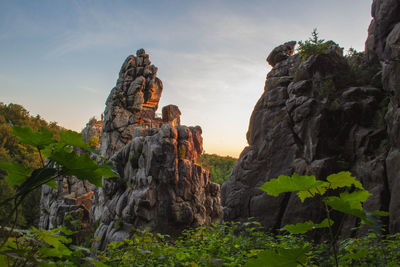 Rock formations on mountain against sky