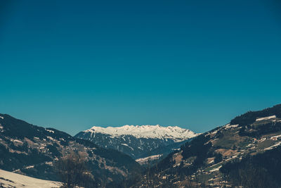 Scenic view of mountains against clear blue sky at night