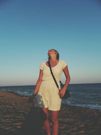 Woman standing on beach