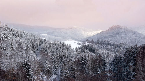 Scenic view of snow covered mountains against sky