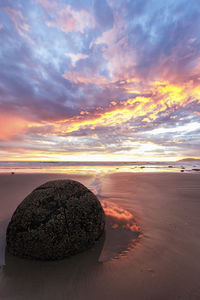 Scenic view of sea against sky at sunset