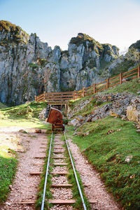 Railroad track against mountains