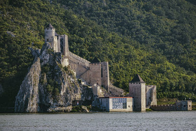 Exterior of historic building, castle, by mountain