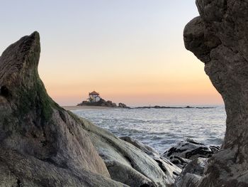 Scenic view of sea against clear sky during sunset