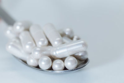 Close-up of eggs over white background