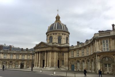 View of buildings in city against sky