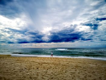 Mature woman walking at beach