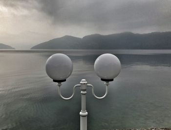 View of lake against cloudy sky