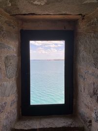 Sea seen through window