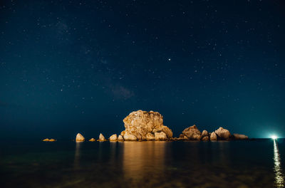 Scenic view of sea against sky at night