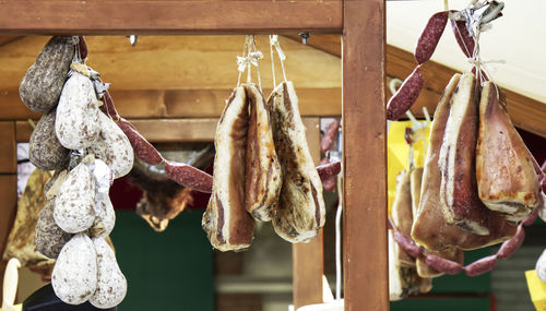 Close-up of fish hanging on wood