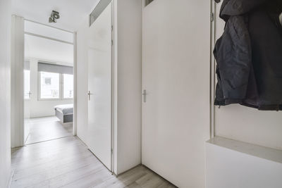 Low section of woman standing in corridor
