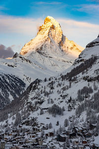 Scenic view of snowcapped mountains against sky