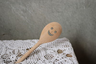 Close-up of smiley face on wood