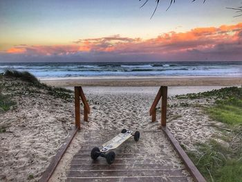 Scenic view of beach against sky during sunset