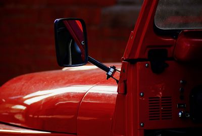 Close-up of red vintage car