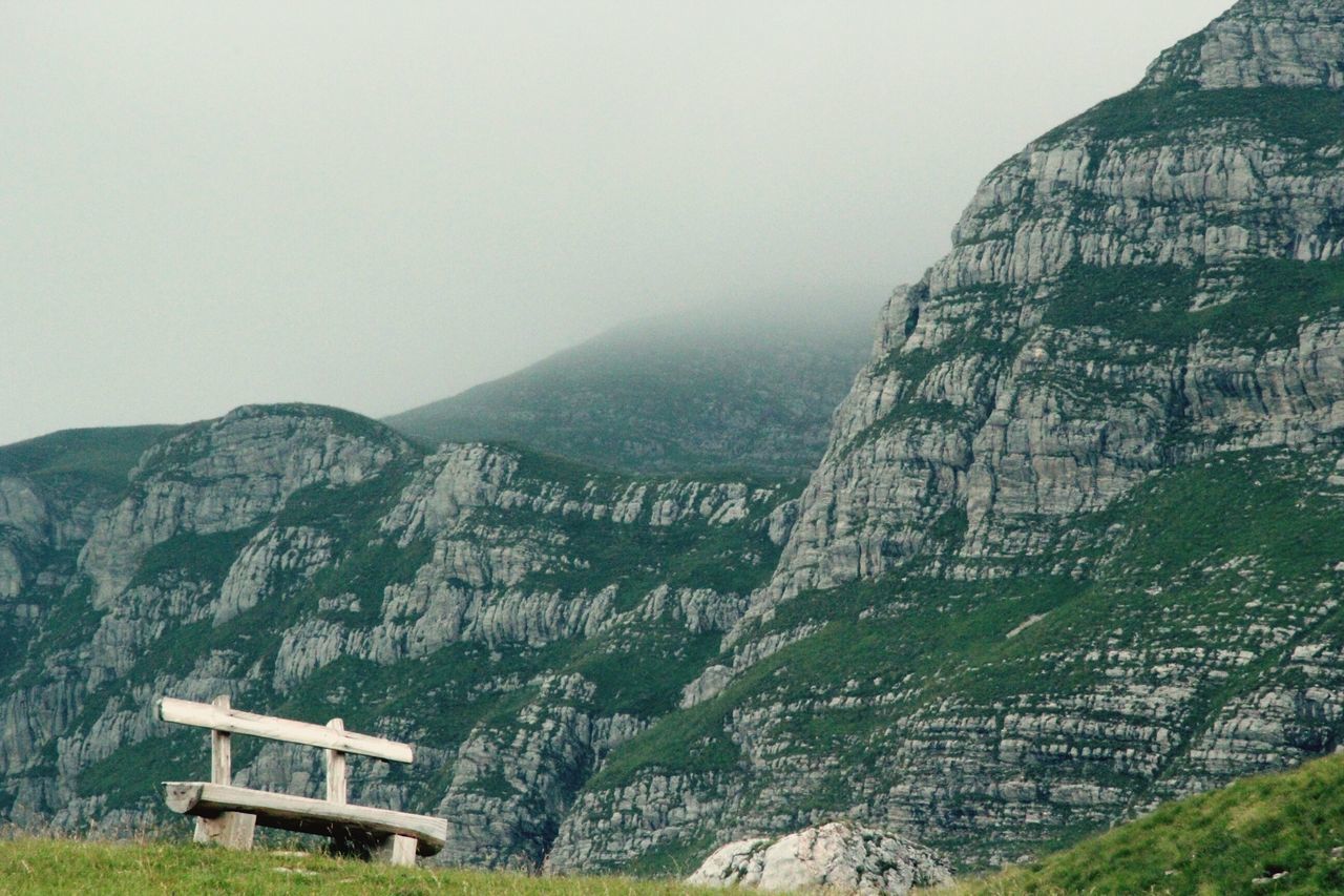 mountain, mountain range, tranquility, tranquil scene, scenics, landscape, beauty in nature, nature, tree, fog, non-urban scene, valley, built structure, sky, hill, idyllic, rock - object, high angle view, day