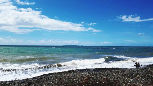 Scenic view of sea against blue sky