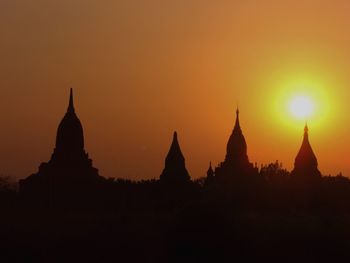 Silhouette of temple at sunset