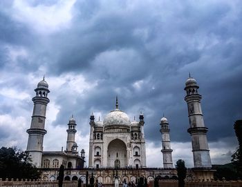 Low angle view of building against cloudy sky