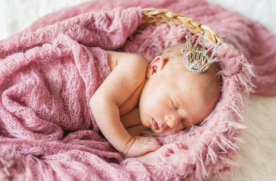 Cute baby sleeping in crib at home