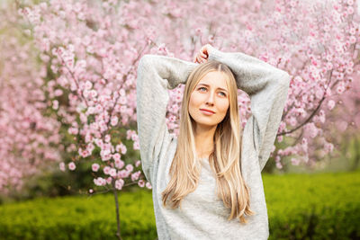 Young woman standing on field