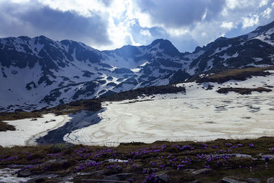 Scenic view of snowcapped mountains against sky