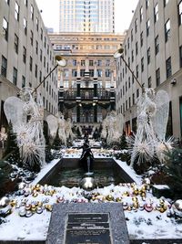 Statue in city during winter