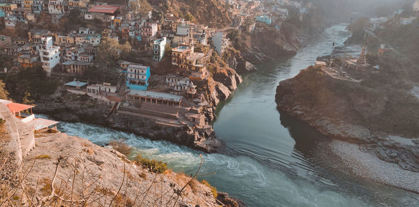 High angle view of river amidst buildings in city