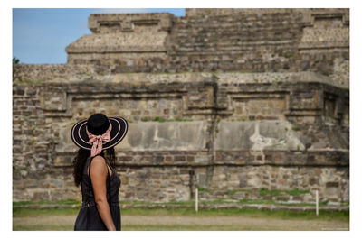 Side view of woman wearing hat