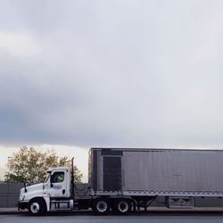 Cars on road against sky