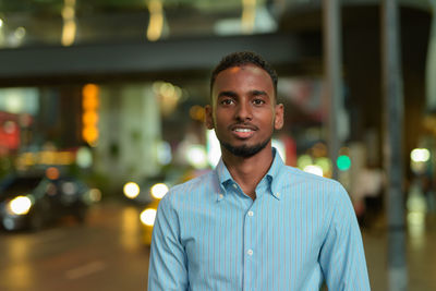 Portrait of young man standing outdoors