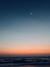 Scenic view of sea against sky at sunset