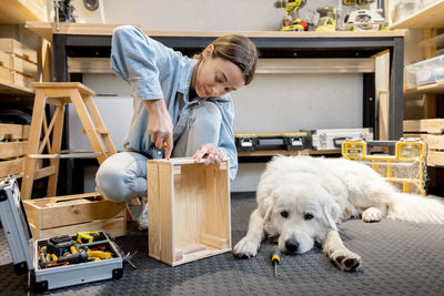 Woman with dog at workshop