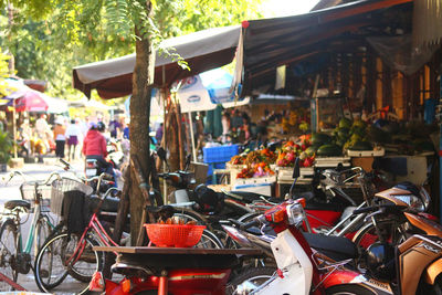 Vehicles against market stall