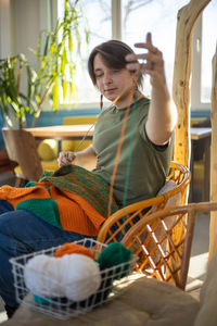 Portrait of young woman holding basket