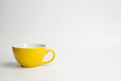 Close-up of coffee cup against white background