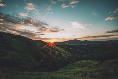 Scenic view of landscape against sky during sunset