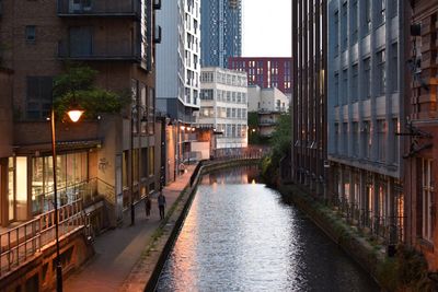 Canal amidst buildings in city