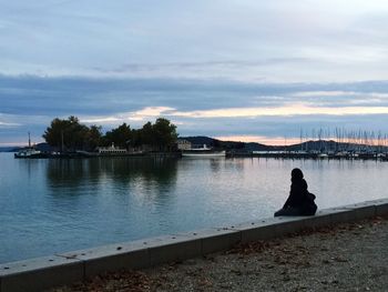 Scenic view of lake against sky during sunset