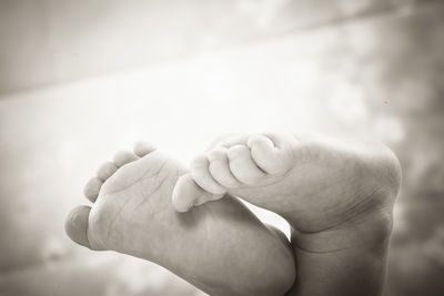 Cropped image of baby feet