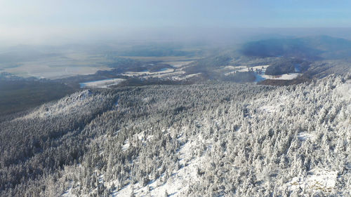 High angle view of snowcapped mountains against sky