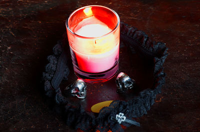 High angle view of tea light candle on table