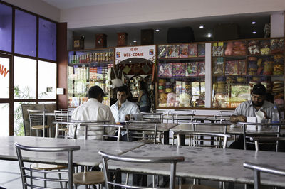 Rear view of people sitting in restaurant