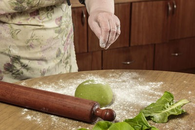 Midsection of woman preparing food