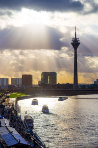City skyline against cloudy sky