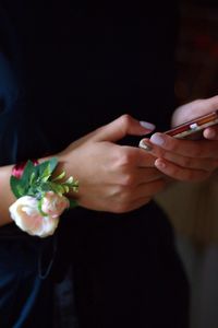 Close-up of woman hand holding flower