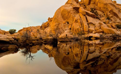 Close-up of rock formation against sky