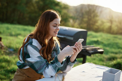 Young woman using mobile phone